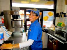 Friendly drive-thru staff at Charcoal Delights Restaurant in Chicago