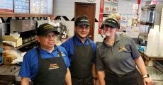 Hard working kitchen staff at Charcoal Delights Restaurant Des Plaines