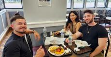 Friends enjoying lunch at Charcoal Flame Grill in Morton Grove