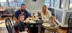 Family enjoying lunch at Charcoal Flame Grill in Morton Grove