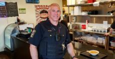 Police officer enjoying lunch at Charkie's Restaurant in Carol Stream