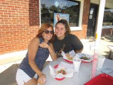 Family enjoying lunch outside at Craving Gyros Restaurant in Lake Zurich