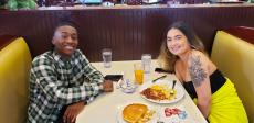 Young couple enjoying breakfast at Dino's Cafe in Bloomingdale