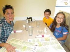 Family enjoying lunch at Eggs Inc. Cafe - Chicago