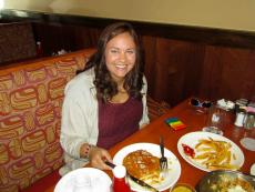 Customer enjoying pancakes at Eggs Inc. Cafe in Naperville