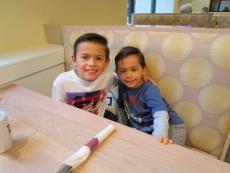 Brothers ready to enjoy breakfast with Mom at Eggs Inc. Cafe in Chicago