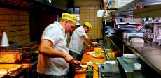 Hard working kitchen crew at Franksville Restaurant in Chicago