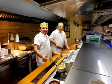 Hard working kitchen crew at Franksville Restaurant in Chicago