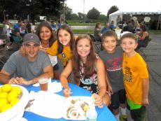 Family enjoying the Glenview Greek Fest at Sts. Peter & Paul Greek Orthodox Church