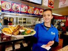 Friendly staff serving shish-ka-bob at Goodi's Restaurant in Niles