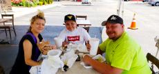 Family enjoying an outdoor lunch at Goodi's Restaurant in Niles