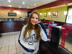 Young customer enjoying lunch at Goodi's Restaurant in Niles