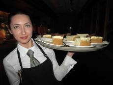 Friendly server with desserts at Jameson's Charhouse in Arlington Heights