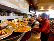 Busy wait staff serving delicious items at Kappy's American Grill in Morton Grove