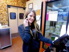 Friendly staff taking carry-out order at Kosta's Gyros in Algonquin