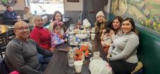 Family enjoying lunch at Les Brothers Restaurant in Oak Lawn