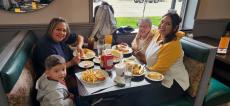 Family enjoying lunch at Les Brothers Restaurant in Oak Lawn