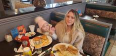 Family enjoying lunch at Les Brothers Restaurant in Oak Lawn