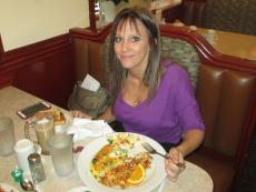 Loyal patron enjoying breakfast at Omega Restaurant in Downers Grove