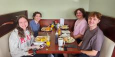 Friends enjoying breakfast at Maple Butter Cafe in Plainfield