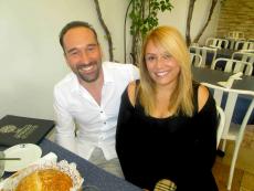 Couple enjoying lunch on the patio at Mykonos Greek Restaurant in Niles