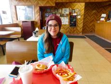 Happy customer enjoying lunch at Nick's Drive In Restaurant in Chicago