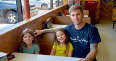 Family enjoying lunch at Nick's Drive In Restaurant in Chicago