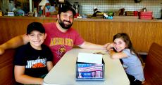 Family enjoying lunch at Nick's Drive In Restaurant in Chicago