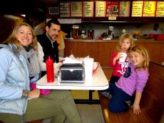 Family enjoying lunch at Nick's Drive In Restaurant in Chicago
