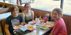 Friends enjoying lunch at Nick's Drive-In Restaurant in Chicago