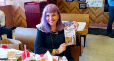 Happy customer enjoying lunch at Nick's Drive-In Restaurant in Chicago