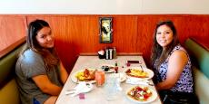 Mom and daughter enjoying breakfast at Tasty Waffle Restaurant in Romeoville