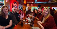 Friends enjoying dinner at Niko's Red Mill Tavern in Woodstock