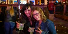 Friends enjoying drinks at Niko's Red Mill Tavern in Woodstock