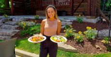 Showing off the famous salads at Niko's Red Mill Tavern in Woodstock