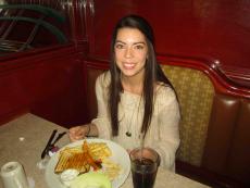  Customer enjoying breakfast at Omega Restaurant & Pancake House in Downers Grove