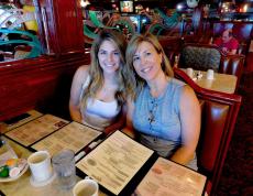 Family enjoying breakfast at Omega Restaurant & Pancake House in Downers Grove