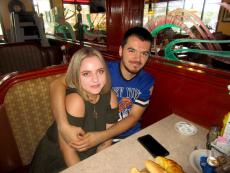 Young couple enjoying breakfast at Omega Restaurant & Pancake House in Downers Grove