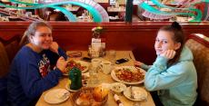 Friends enjoying breakfast at Omega Restaurant & Pancake House in Downers Grove