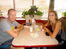 Family enjoying breakfast at Omega Restaurant & Pancake House in Downers Grove