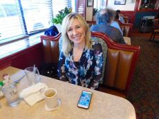 Customer enjoying breakfast at Omega Restaurant & Pancake House in Downers Grove