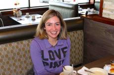 Customer enjoying lunch at Omega Restaurant & Pancake House in Schaumburg