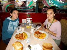 Friends enjoying breakfast at Omega Restaurant & Pancake House in Downers Grove