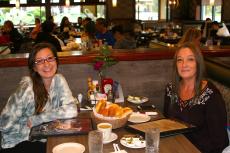 Friends enjoying lunch at Omega Restaurant & Pancake House in Schaumburg