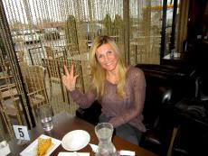 Customer enjoying Greek pastry at Papagalino Cafe & Pastry Shop in Niles