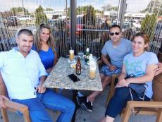 Friends enjoying drinks and sweet treats at Papagalino Cafe & Pastry Shop in Niles