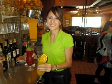 Friendly server with refreshing drinks at Plainfield's Delight Restaurant in Plainfield