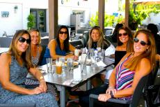 Friends enjoying the outdoor patio at Plateia Mediterranean Kitchen & Bar in Glenview