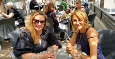 Friends enjoying the outdoor patio at Plateia Mediterranean Kitchen & Bar in Glenview