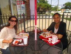 Friends enjoying lunch on the outdoor patio at Plush Pup Gyros in Chicago